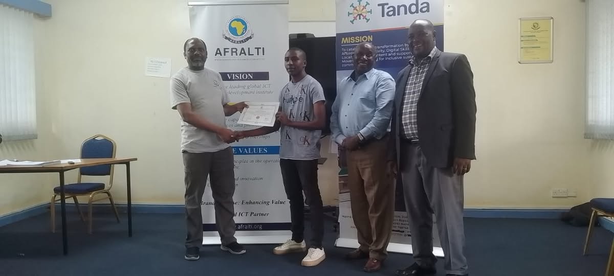 AthiCN community member receiving a fibre-optics training certificate at AFRALTI